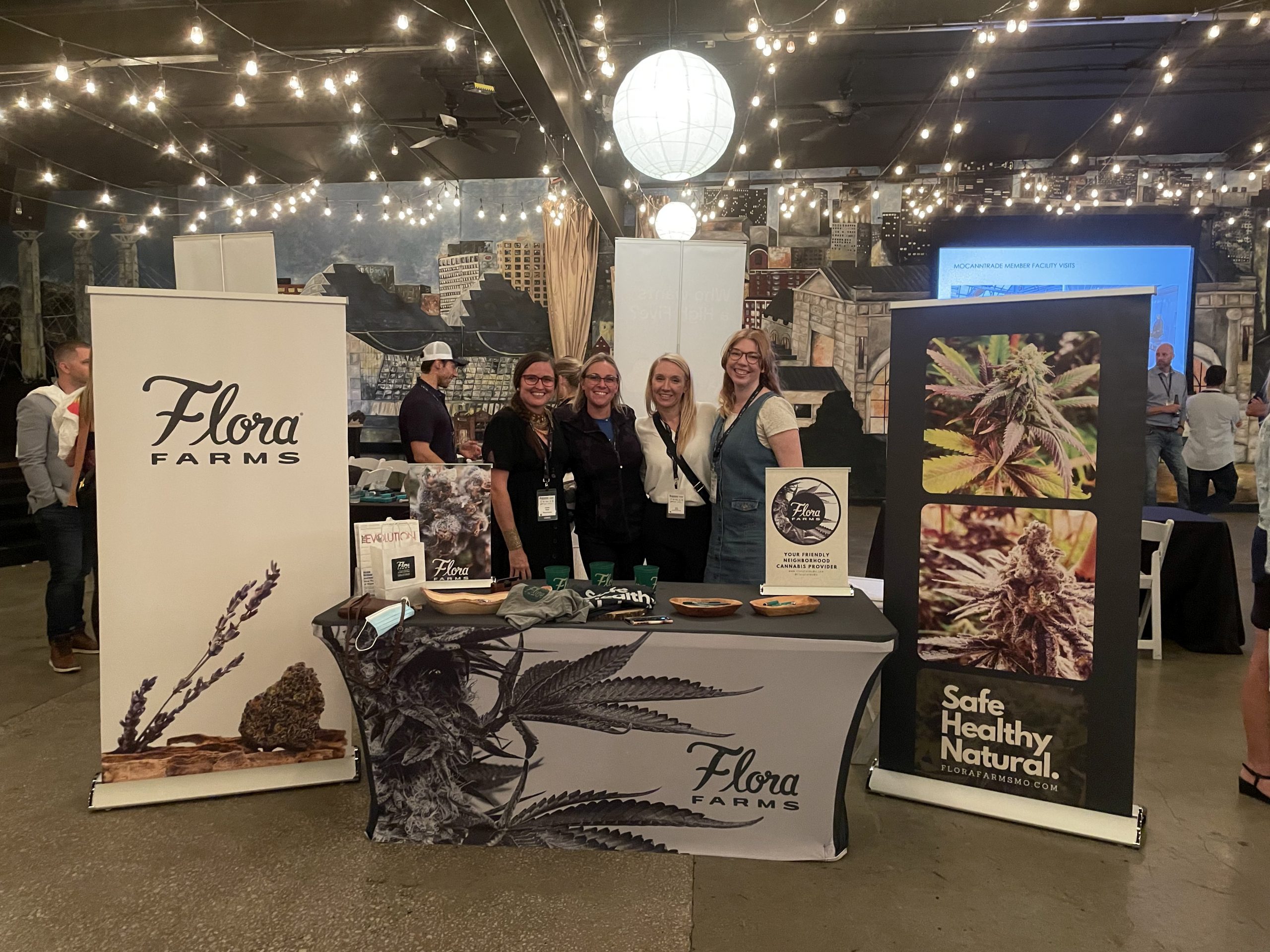 Flora Farms marketing team poses with Cannabis Care Team members April Hatch and Melissa Rush